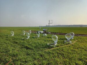 Soil greenhouse gas chambers and eddy covariance flux tower in field of wheat.