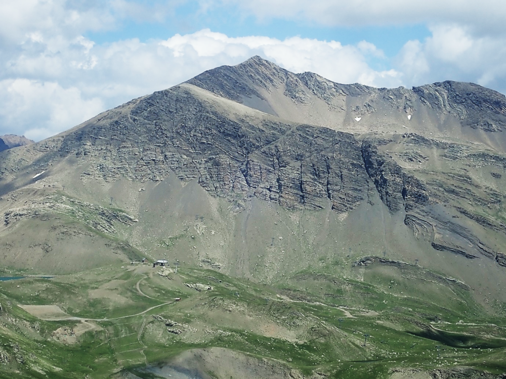 Western margin of the Eastern Champsaur Basin, showing complicated syn- and post-depositional deformation. Note ski hut for scale bottom left.